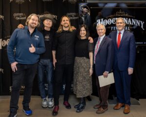 Left to right: Rich Ide, vice president of IDE Family of Dealerships, festival presenting sponsor; Tommy Brunett, co-owner of Hoochenanny; Sean McCarthy, co-owner of Hoochenanny; Jenn Townsend, Perinton town supervisor; Don Jeffries, president and CEO of Visit Rochester; Monroe County Executive Adam Bello. Photo by Tomas Flint for Hoochenanny, 2026.